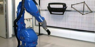 Robotic solution for automated paint centre