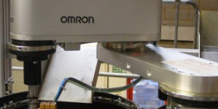 Omron SCARA robot assembles spigots cost effectively