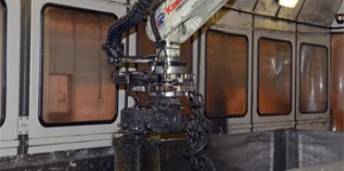 Robot cleans up ash in aggressive environment
