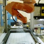 Hanging robot reduces footprint in contact lens production