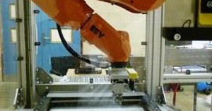 Hanging robot reduces footprint in contact lens production