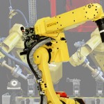 Robot for small or densely populated weld cells