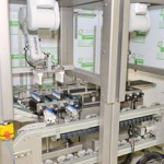 Driven track for robot cell’s product transportation