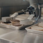 Universal Robots assist with burger flipping