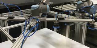 Universal robot eliminates heavy lifting for printer