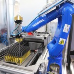 Robotic tending for automatic grinding machine